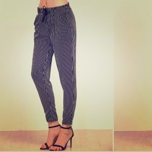 Vertical pinstriped tapered leg pants